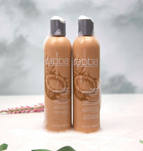 Load image into Gallery viewer, Two bottles of brown product
